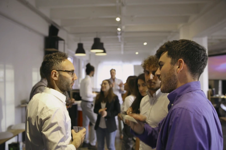 a group of people standing in a room
